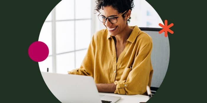 Women Smiling at a Laptop